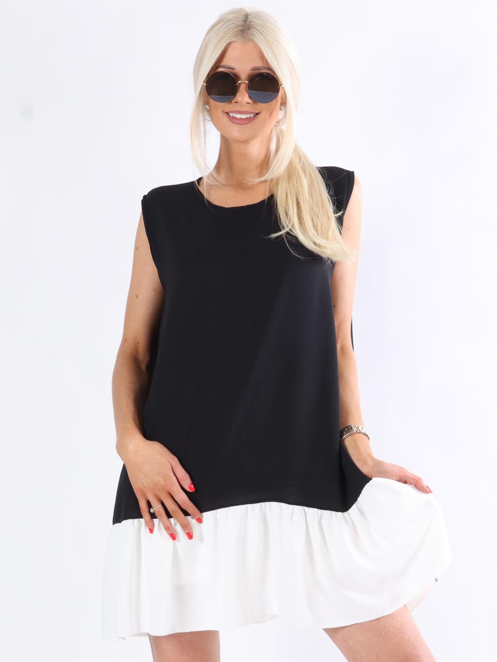 Manola - Kjole i løs pasform med flæsekant forneden